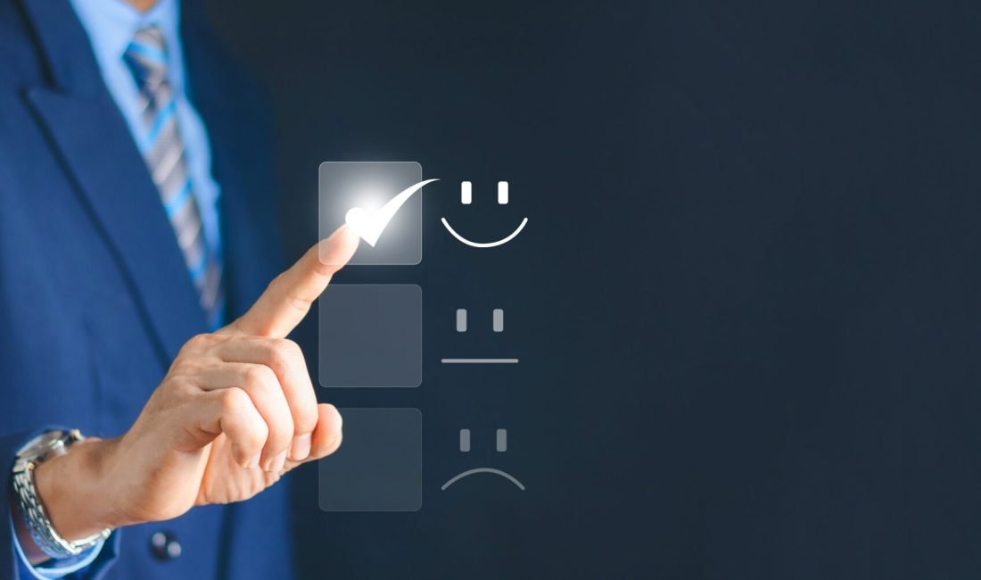 Customer Service and Satisfaction Concept Businessman is touching the virtual screen on the happy Smiley face icon to satisfy the service. Rating Very impressed.